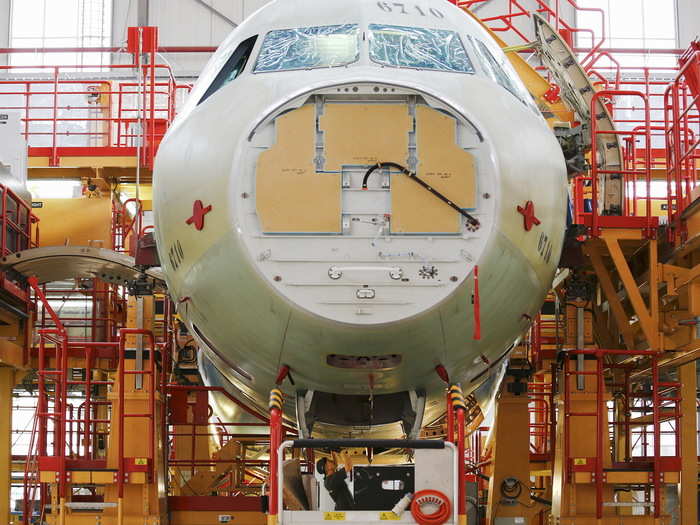 Safety is paramount, and the neon colored walkways stand in contrast to the unpainted plane