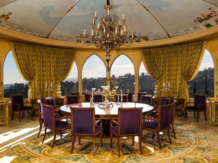 Between the arched windows and ceiling mural, the dining room is practically a temple of worship.