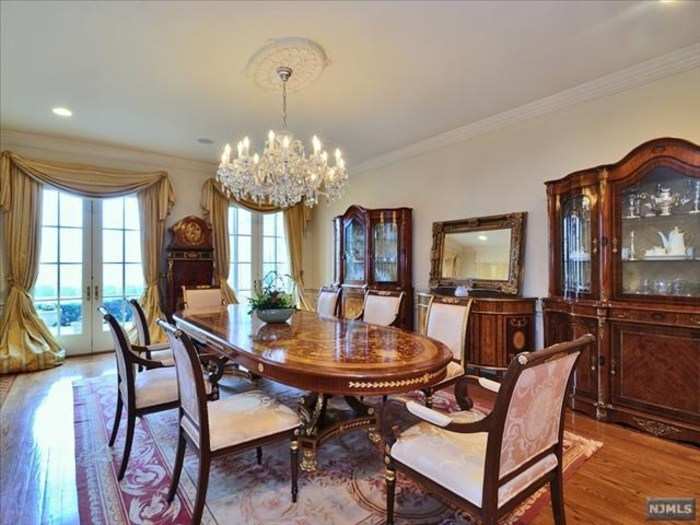 The formal dining room has plenty of space for a family dinner.