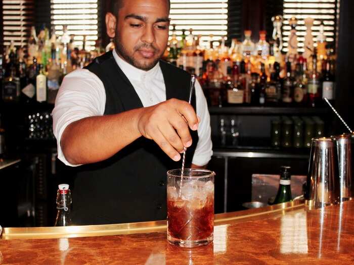 Throw one-and-a-half ounces coffee-infused bourbon, a half-ounce amaro, three dashes fernet, and two dashes bitters into a mixing glass with ice and stir for about 30 seconds. You can also build the drink right in the rocks glass.