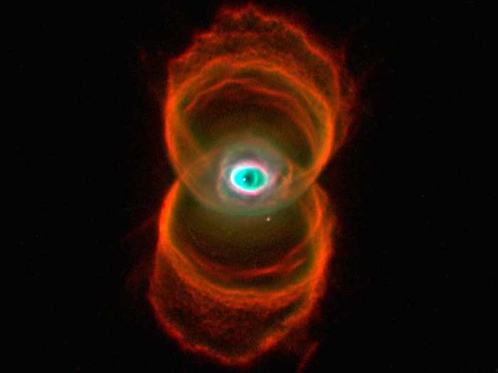 This young planetary nebula located about 8,000 light-years away resembles an hourglass viewed from the side. The image is a composite of three separate images taken by Hubble in the light of ionized nitrogen (red), hydrogen (green), and doubly-ionized oxygen (blue).