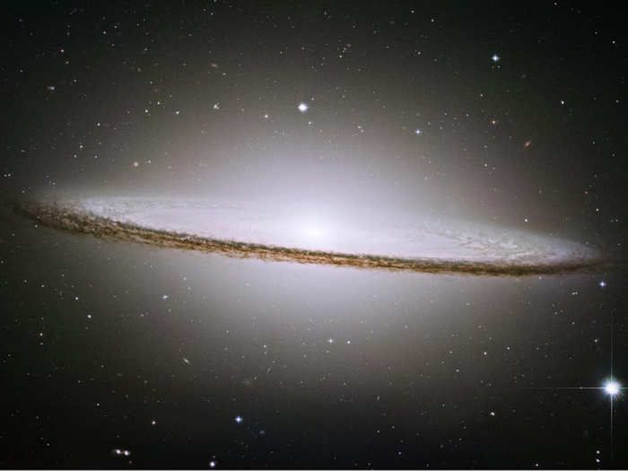 The sombrero galaxy owes its Mexican hat shape to an abnormally large central bulge containing billions of old stars and dark dust lanes seen when a galactic disk is viewed edge-on. This image from March 2008 was taken by Hubble.