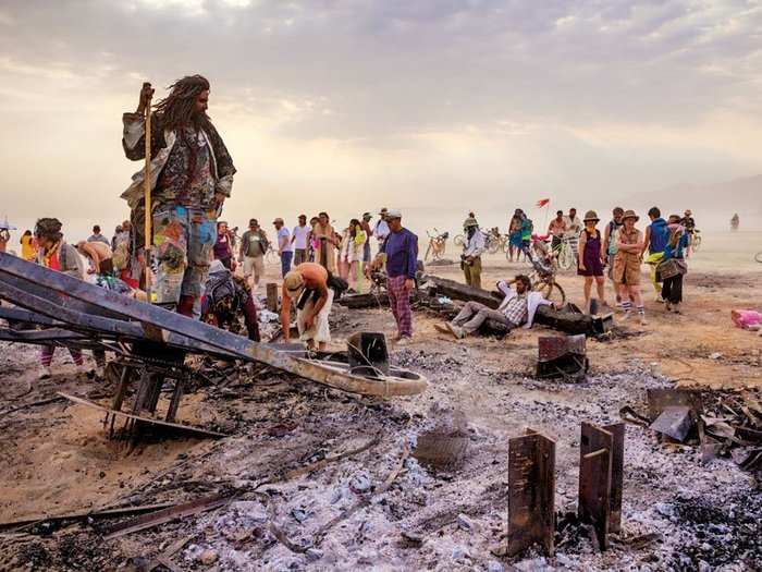 In a photo taken after the man burn in 2013, participant Kaspian Khalafi surveys the wreckage.