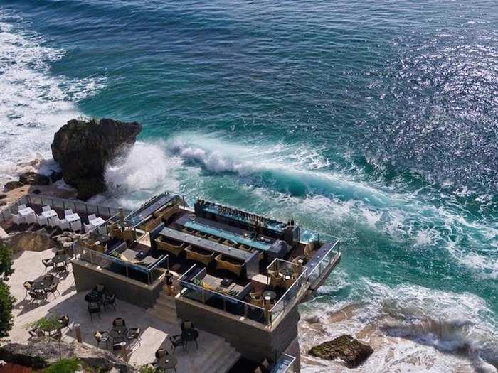 Rock Bar in Kuta, Bali, is carved into a cliff face and overlooks the Indian Ocean from a rocky perch 46 feet above crashing waves. Even better than literally sitting on the water? Having to take a four-person cable car to get there.