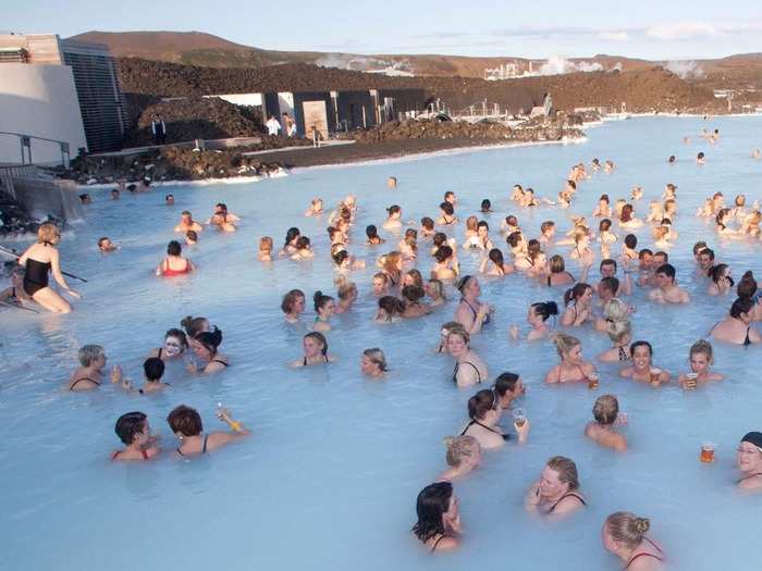 Iceland’s Blue Lagoon, located in Grindavik, is known for its healing effects thanks to its large abundance of minerals. The lagoon also hosts a bar, where waitresses serve you cocktails as you rest in the soothing heated water.