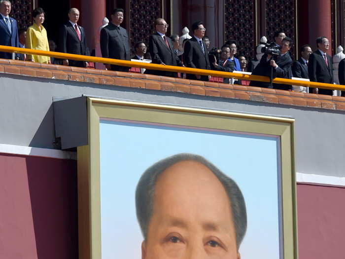 After the speech, Xi joined Kazakh President Nursultan Nazarbayev, South Korean President Park Geun-hye, and Russian President Vladimir Putin on a balcony above a giant portrait of Mao.