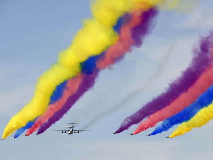 Chinese J-10s streaked the clear skies with colorful smoke.