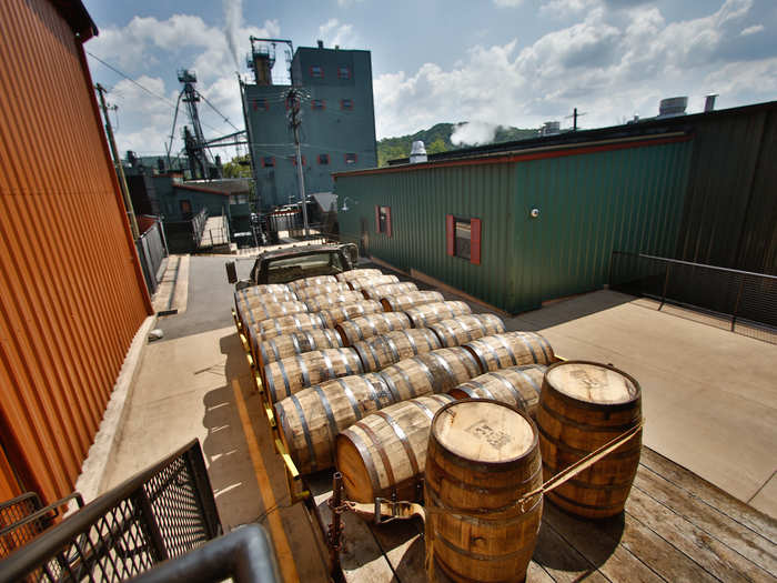 Here, barrels of bourbon ready to be aged are loaded onto a truck that will take them to one of the over 70 rackhouses Jim Beam owns.