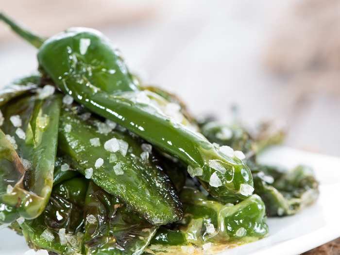 Pimientos de Padrón are small peppers that come from Galicia, in the northern part of Spain. They’re fried in oil and salted, and every so often a few of them will have an extremely spicy flavor.