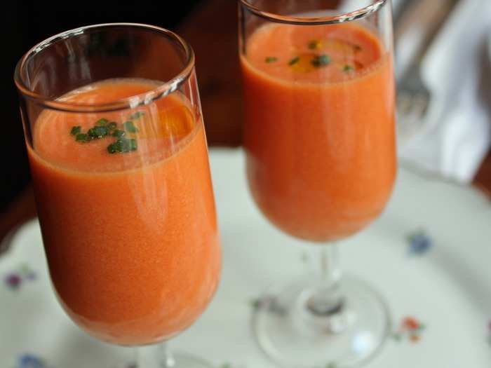 Gazpacho is a cold soup originally from the southern Spanish region of Andalusia. Vegetables like garlic, onions, peppers, and cucumbers will be chopped and mixed with oil and vinegar to create a refreshing soup that