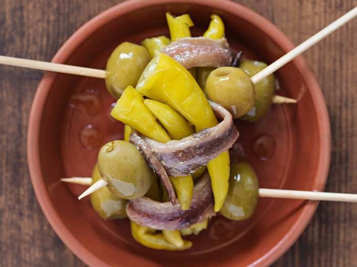 Gildas are a simple assembly of anchovy, olives, and chili peppers.