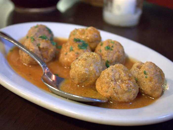 Albondigas are Spanish meatballs that come with a wide range of dishes at tapas bars. Pick up the saucy meatballs — made with pork, beef, or a mixture of both — and pop them into your mouth with toothpicks for a succulent bite.