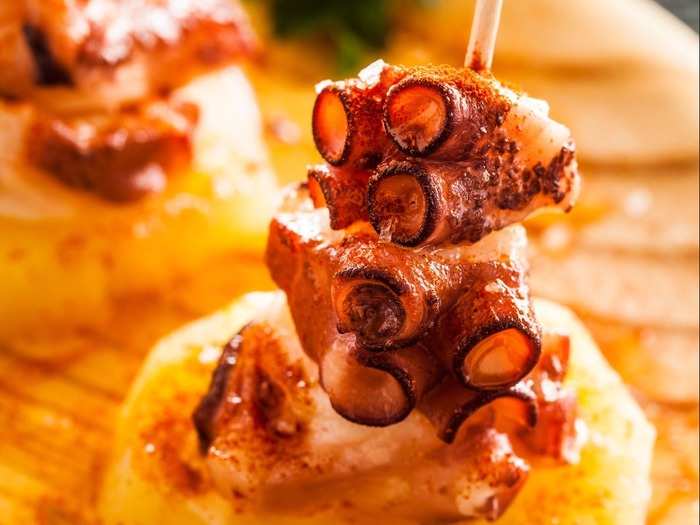 Pulpo a la gallega consists of octopus cooked in boiling water, seasoned in paprika, and served hot in olive oil.