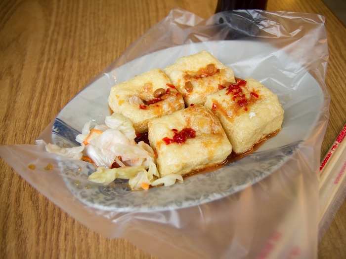 Despite its not-so-appetizing name, stinky tofu (chou dofu) is a staple street food in Shanghai. The odor comes from the fact that the tofu is soaked in fermented milk, vegetables or meat; it can be served deep fried, steamed, braised, barbecued, or stewed.