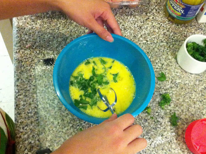 Next I whip up the eggs and cilantro. This recipe calls for a lot of cilantro.