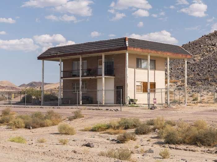 This detached, two-story structure is both guest house and garage, if a bit creepy looking.