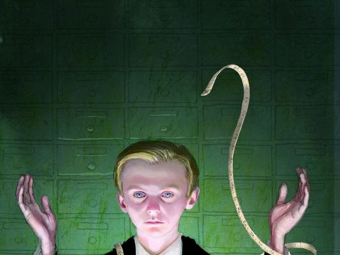 The measuring tape wrapped around Draco Malfoy looks almost serpentine in this image. How fitting for the young Slytherin.