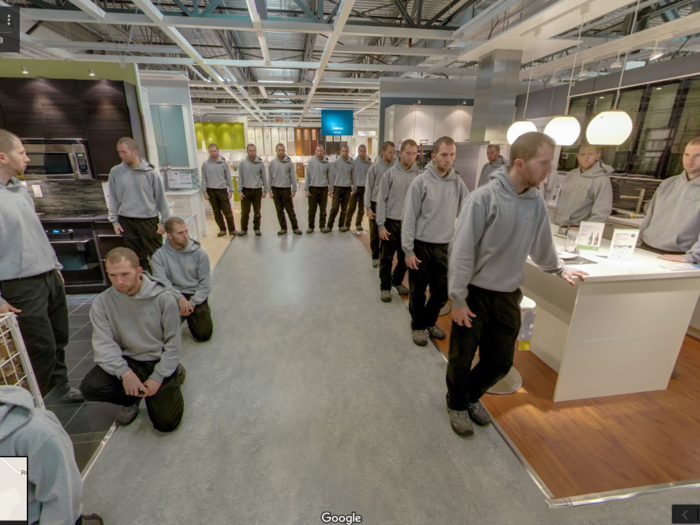 The same guy poses in different ways inside the Montreal IKEA store.