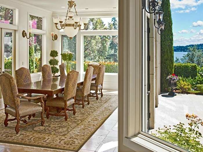 The sunny dining room leads out to the backyard and patio.