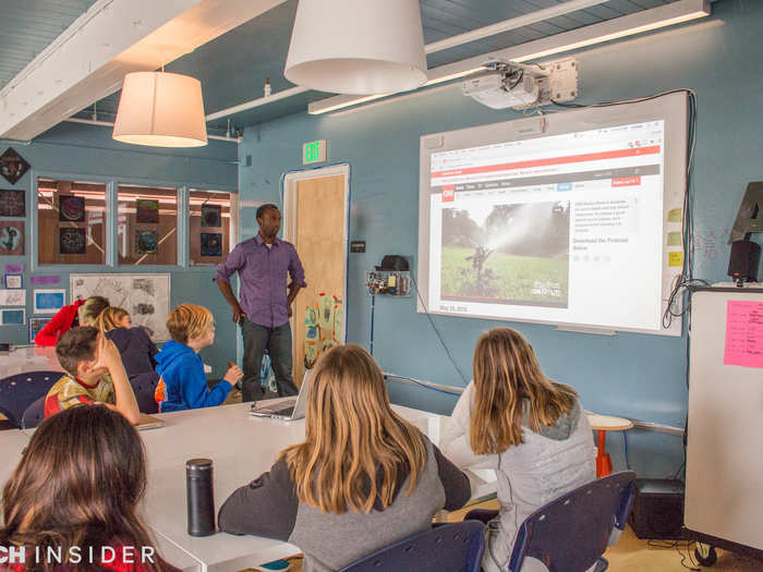 And the "smart" white boards double as TV screens. Here, the class watches a short CNN news program made for kids.