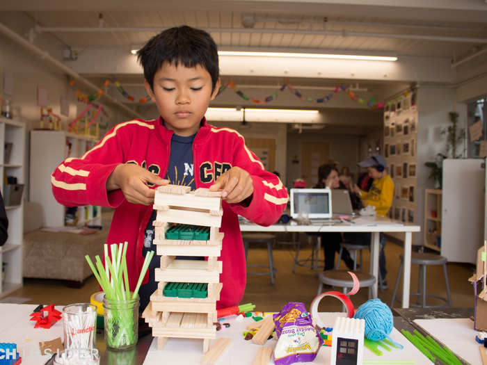 Still, AltSchool values hands-on innovation. This little guy constructs a tower for the class