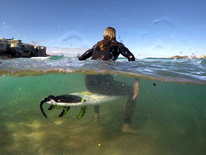 Surfer Arlen Macpherson tested one of the shark repellent boards at Sydney