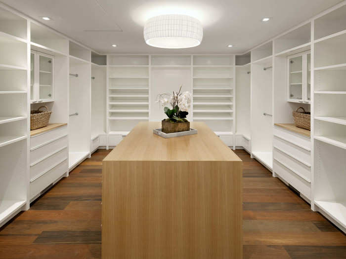 The walk-in closet defies expectations and provides a serene place to get dressed.