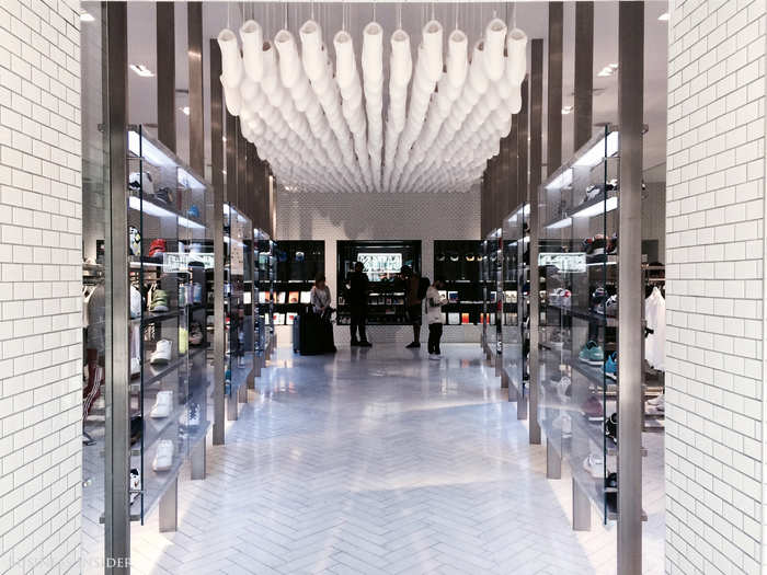 I peeked inside the store itself, and I was not disappointed. Crisp white marble floors, sleek shelves and displays, and an achingly hip monochromatic shoe installation hanging above make this entire store an experience.