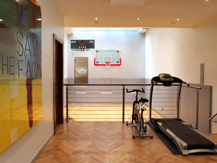 The townhouse has an indoor basketball court for the couple