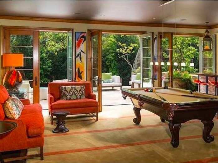 A room with its own pool table has direct access to the outside.