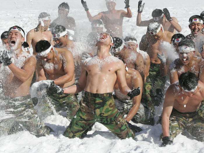 South Korean special warfare are covering themselves with snow here to help strengthen both physical power and psychological fortitude.