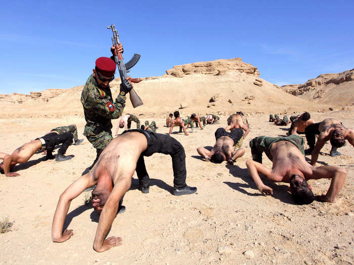 This Iraqi military exercise is not very sophisticated, but it is brutal: do the chair or get beaten.