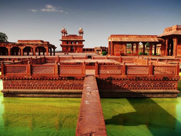 Fatehpur Sikri translates to the city of victory. Built by the Mughal emperor in the 16th century as the capital of the empire — and then later abandoned due to water shortage — the complex of temples, palaces, and monuments is made entirely of bright red sandstone.