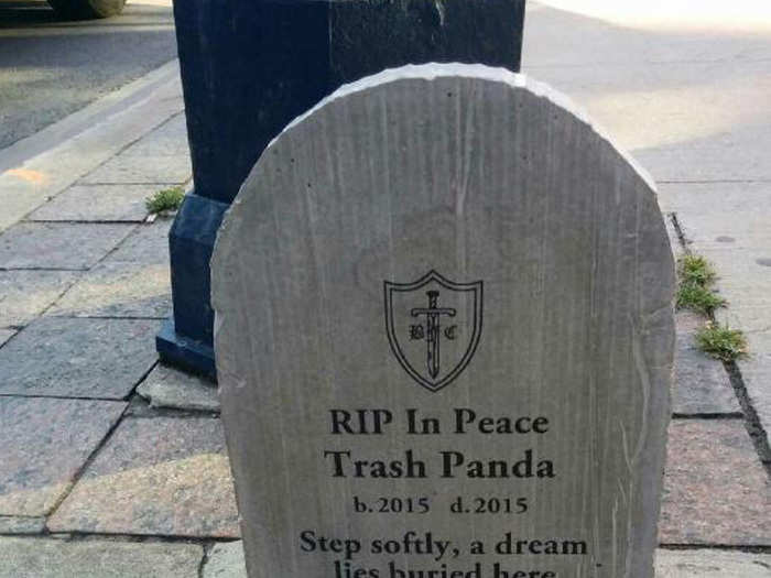 A week after the raccoon was removed, this tombstone was placed in the same spot — calling the raccoon a trash panda.