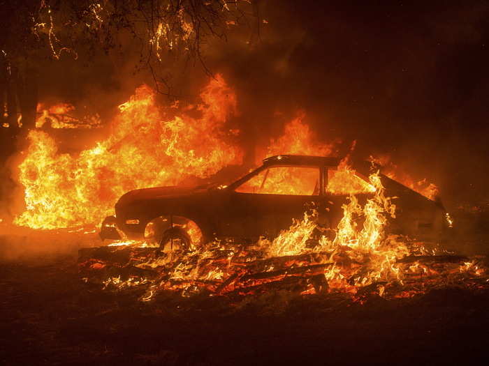 In the process of evacuation, vehicles were left behind. Here, the Butte Fire near Mountain Ranch, California, engulfs a car.