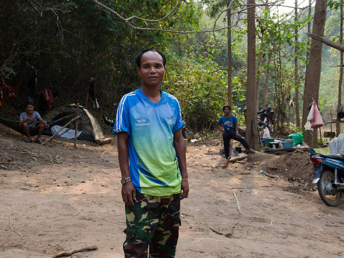 The winding roads through Laos are remote, but the forests were bustling with activity nonetheless. Workers advised him to stay on the road, lest he run over a bomb left over from the country