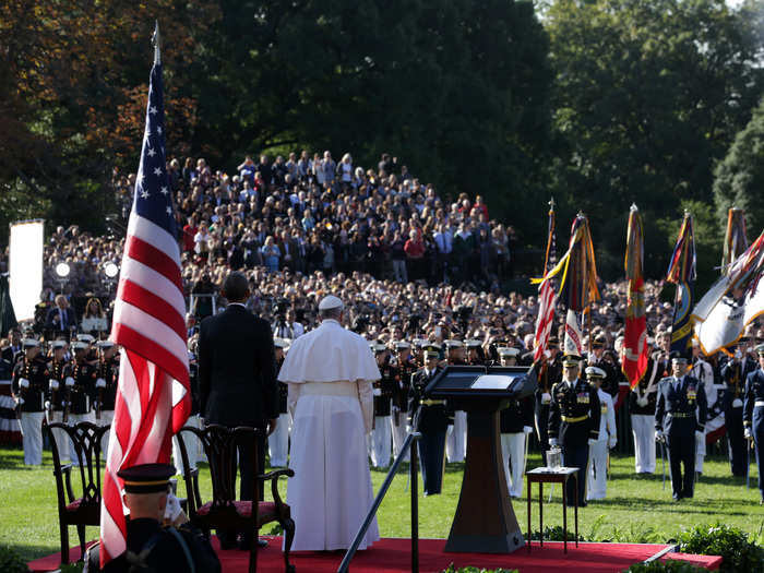 Here, they stand for the national anthem.