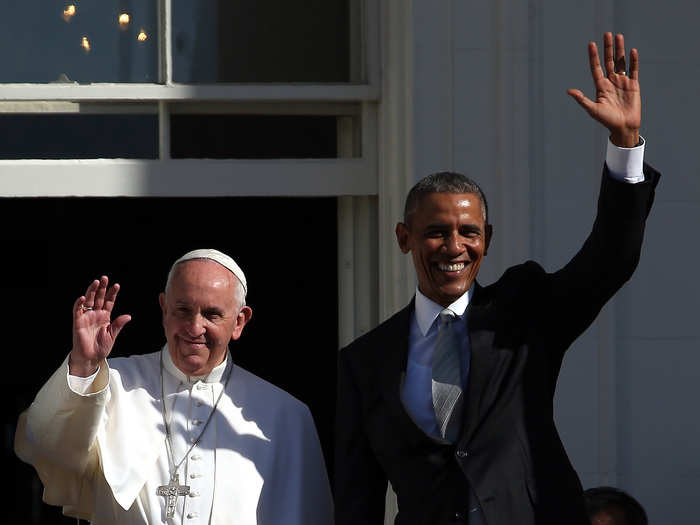 President Obama and Pope Francis wave to the crowd, which was so large that it stretched back around the Ellipse and onto the National Mall.