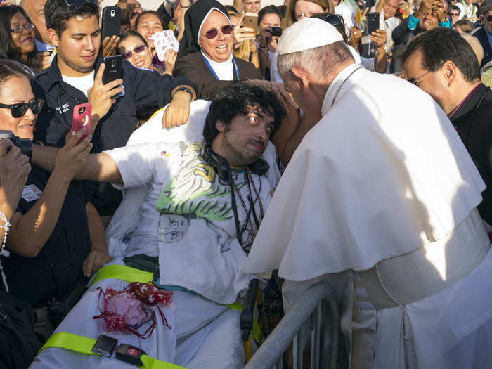 He engaged with the crowd, giving well wishes to Gerard Gubatan of Brooklyn (center left).