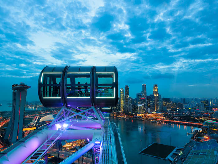 The Singapore Flyer is a large observation wheel that stands 541 feet above the ground. It may be touristy, but it offers breathtaking panoramic views of the city.