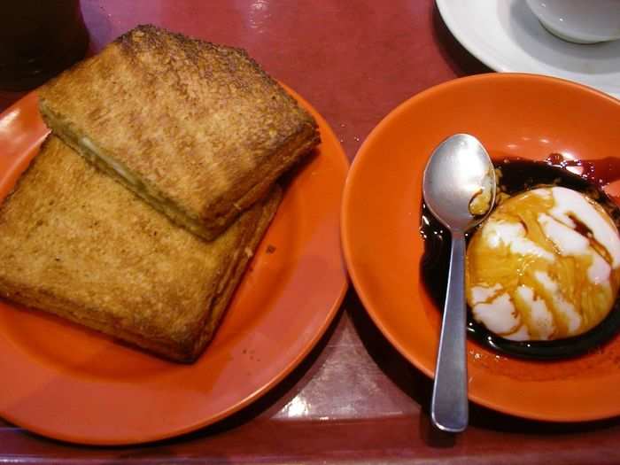 Start your day with a piece of Kaya Toast (toast slathered with sweet coconut jam and butter) and a soft boiled egg from Ya Kun Kaya Toast.