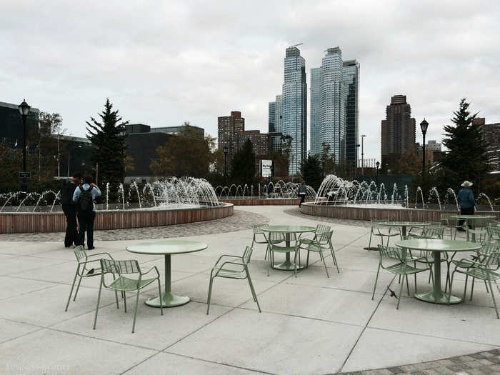 The park offers tables and amphitheater benches in front of three modern fountains and a gorgeous view of towers to the north.