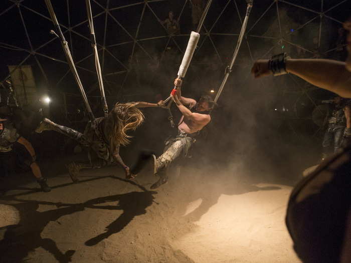 The event embraces other movies and video games within the post-apocalyptic genre, but its heart rests in "Mad Max." Here, some fans fight in a Thunderdome that was erected just for the weekend.