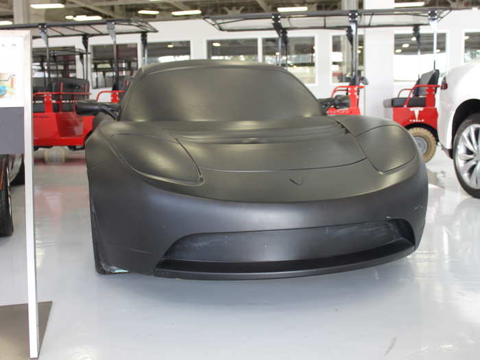 They range from this wood composite mockup of the Tesla Roadster used for wind tunnel testing to...