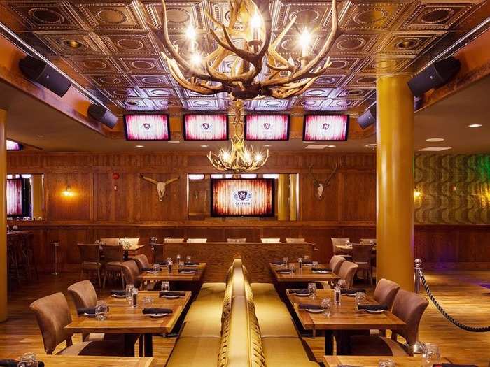 The Gryphon in Washington, DC, offers an upscale rustic feel, where antler chandeliers and wooden accents surround the flat-screen TVs that line its walls. Sports fanatics can also sample premium aged meats, try out the raw bar, or sip on a specialty cocktail.