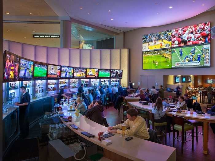 In Boston, Massachusetts, Champions Sports Bar has an open architectural design with high ceilings, sleek private dining rooms, and a circular bar that provides up-close views of whatever game you want to watch.