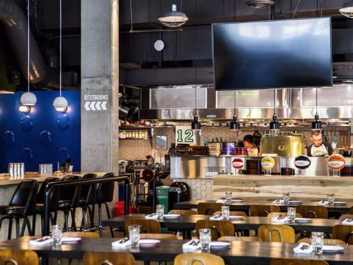 Quality Athletics is a full service sports bar and restaurant in Seattle, Washington, that serves upscale takes on classic sports bar dishes. Game-viewers can enjoy grub like duck wings and a Philly cheesesteak tartine while kicking back in the venue