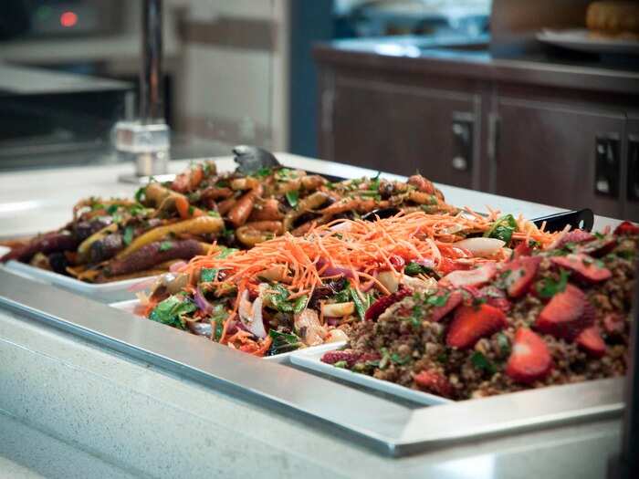 Salad offerings include quinoa with fresh strawberries, Asian slaw with bok choi and carrots, and roasted multicolor baby carrots, all with house-made dressings, and many vegetables are sourced from SAP