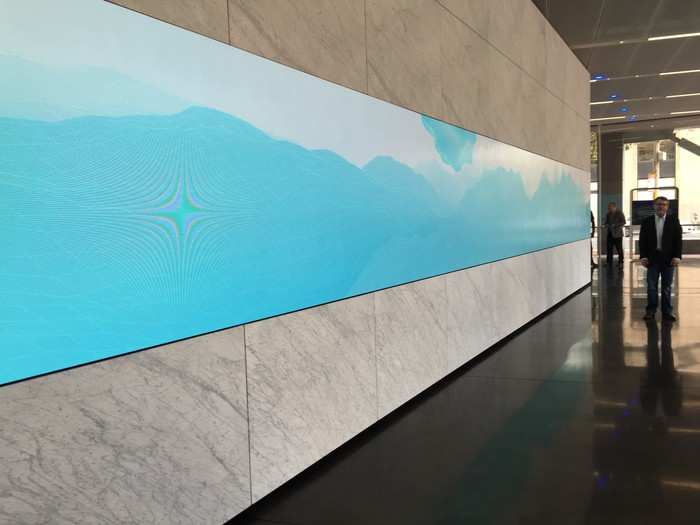 The first thing you see as you enter is the first of 36 art pieces on display throughout the building. This is the "Ribbon Wall," a 60-foot-long video wall that shows a continually-changing landscape that shifts based on the composition that