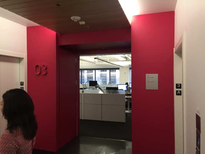 After that, we head upstairs in an elevator. Because the floors look so similar as you exit the elevator, each level has a different color scheme. The colors go in a gradient from magenta, pictured here, to a deep blue on the top floor.